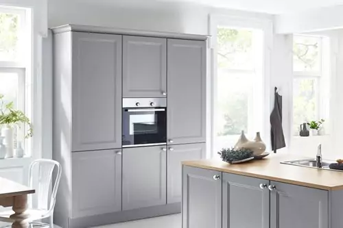 A GREY KITCHEN ISLAND WITH A TOUCH OF NATURE