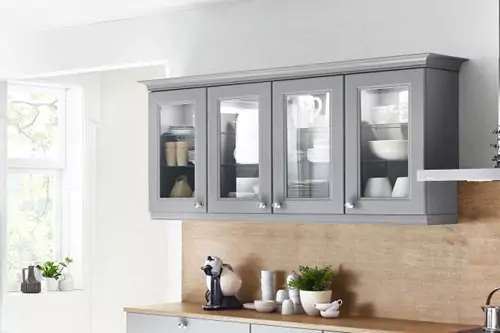 A GREY KITCHEN ISLAND WITH A TOUCH OF NATURE