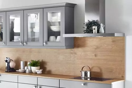 A GREY KITCHEN ISLAND WITH A TOUCH OF NATURE