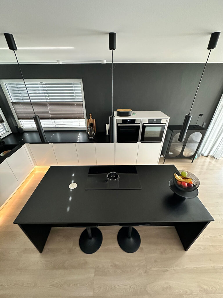 Black Kitchen island with built-in downdraft ventilation